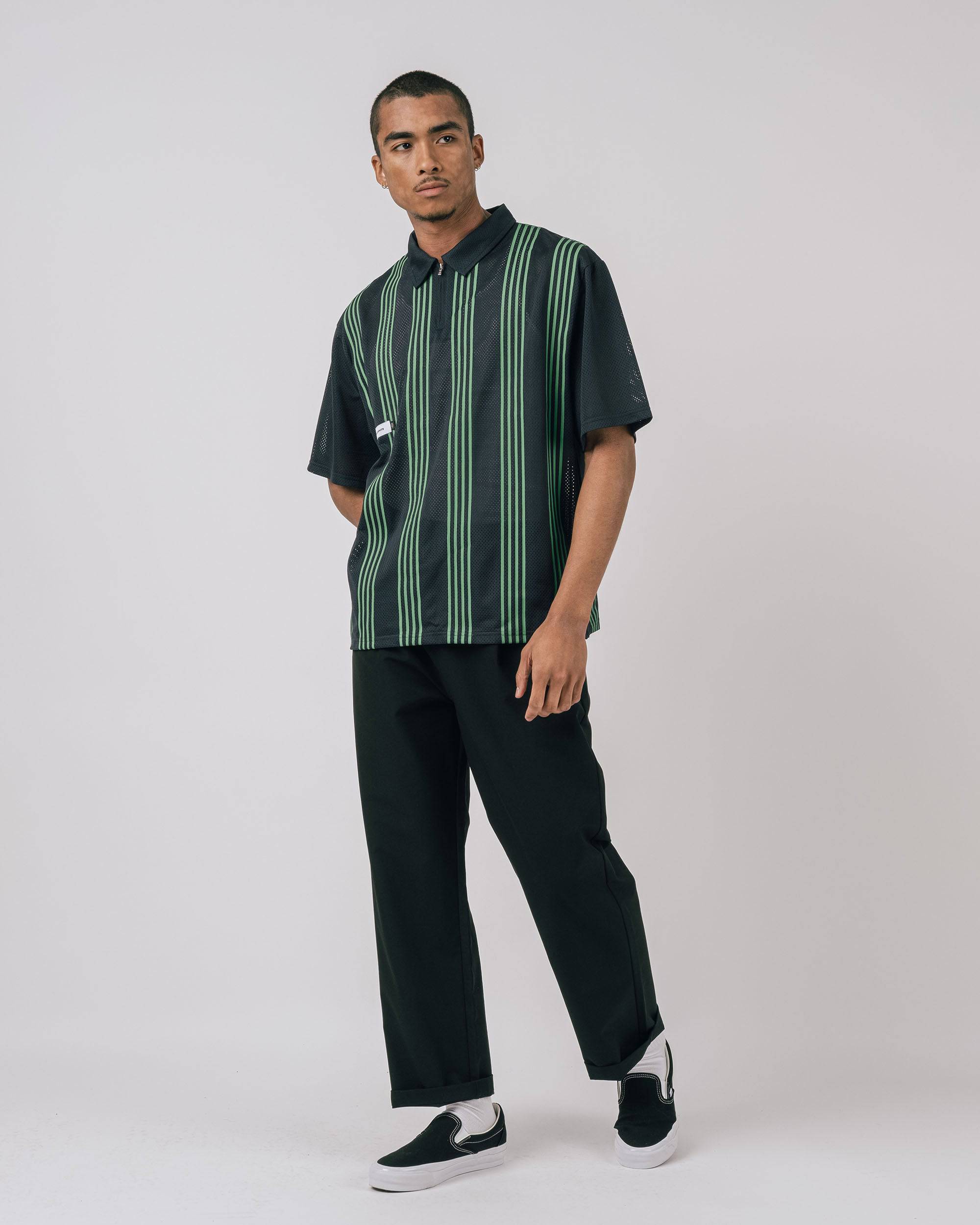 Side view Howard Mesh Zip Polo showing relaxed fit