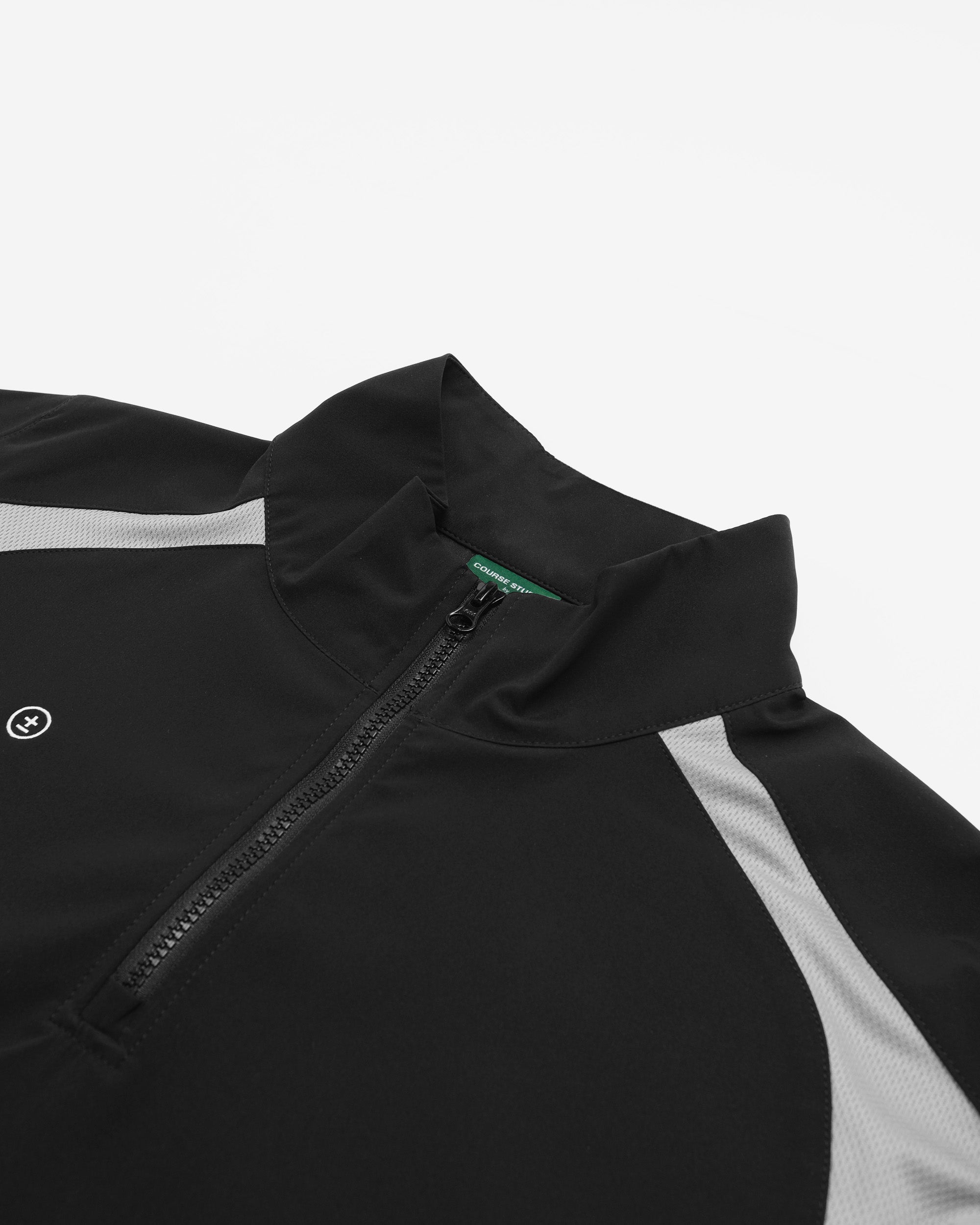 Close-up of a black and gray jacket with a zipper on a white background