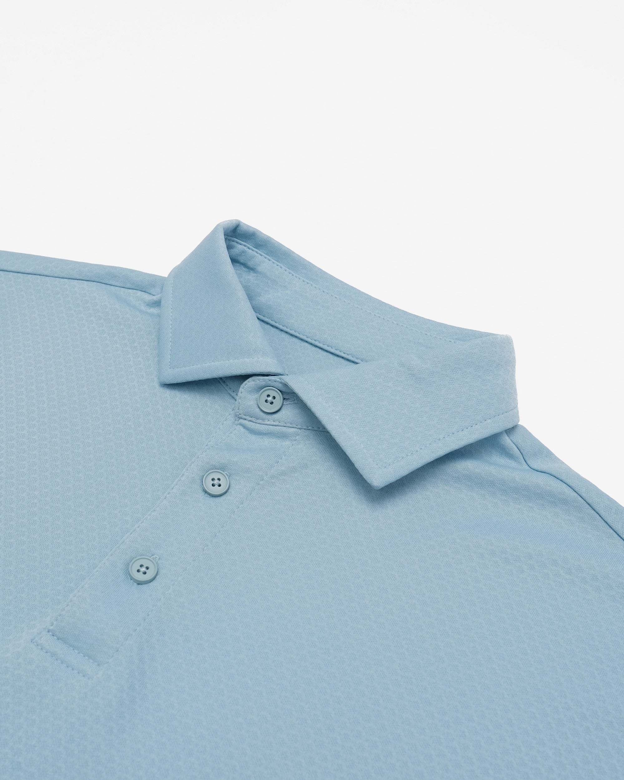 Light blue polo shirt with collar and buttons on a light gray background