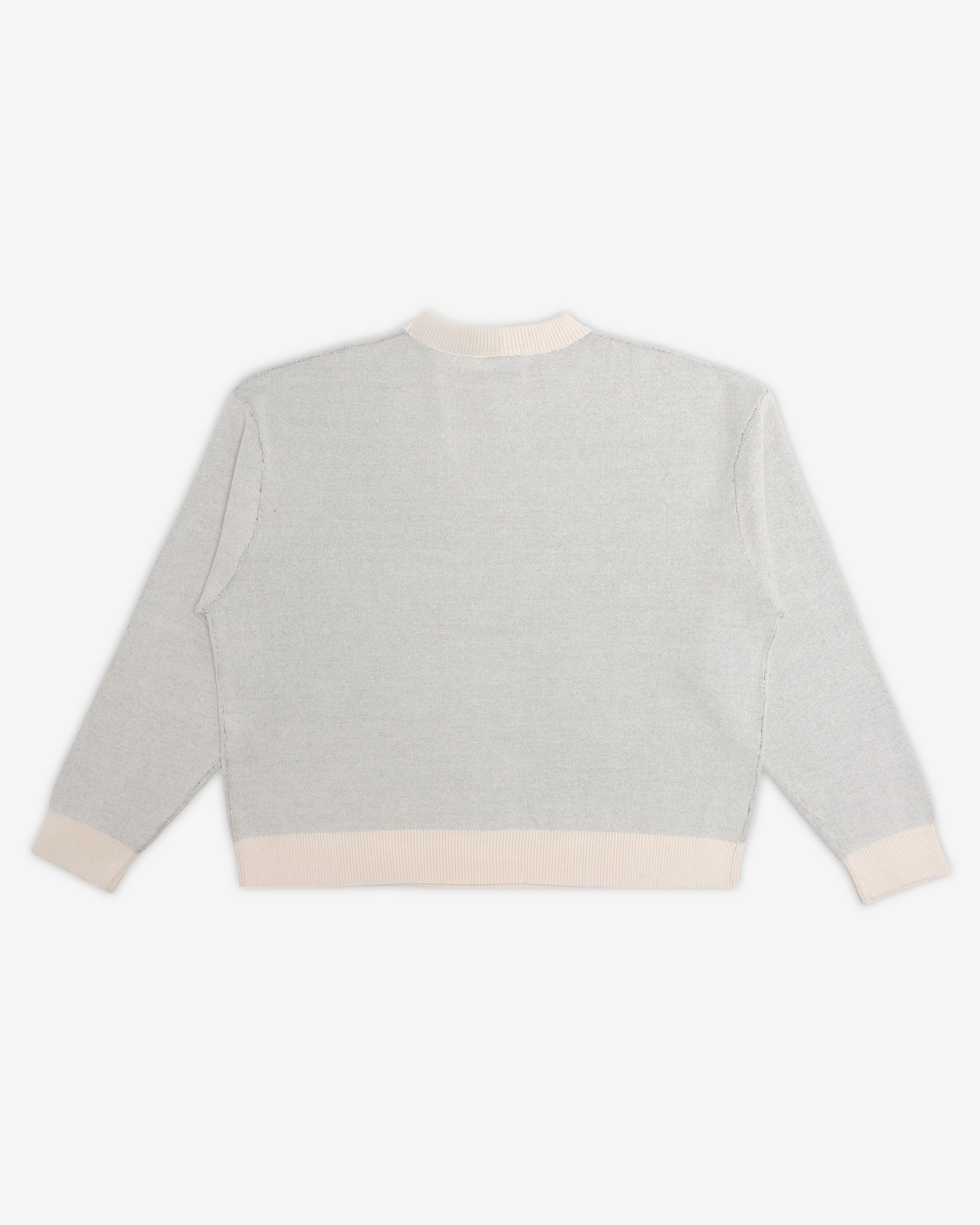 Light gray sweater with cream trim on a white background