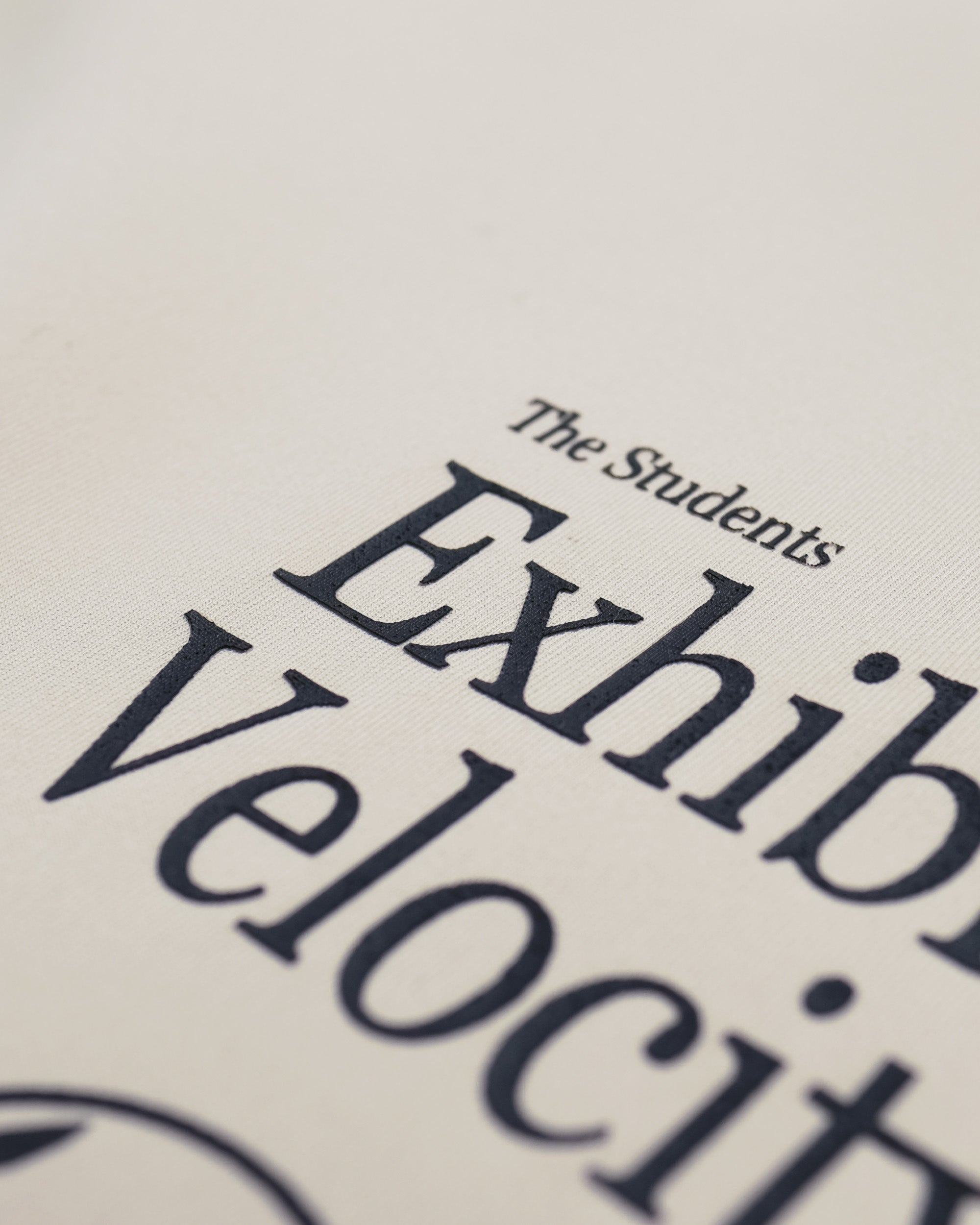 Text on a beige background with 'The Students' Exhibi Velocity' partially visible